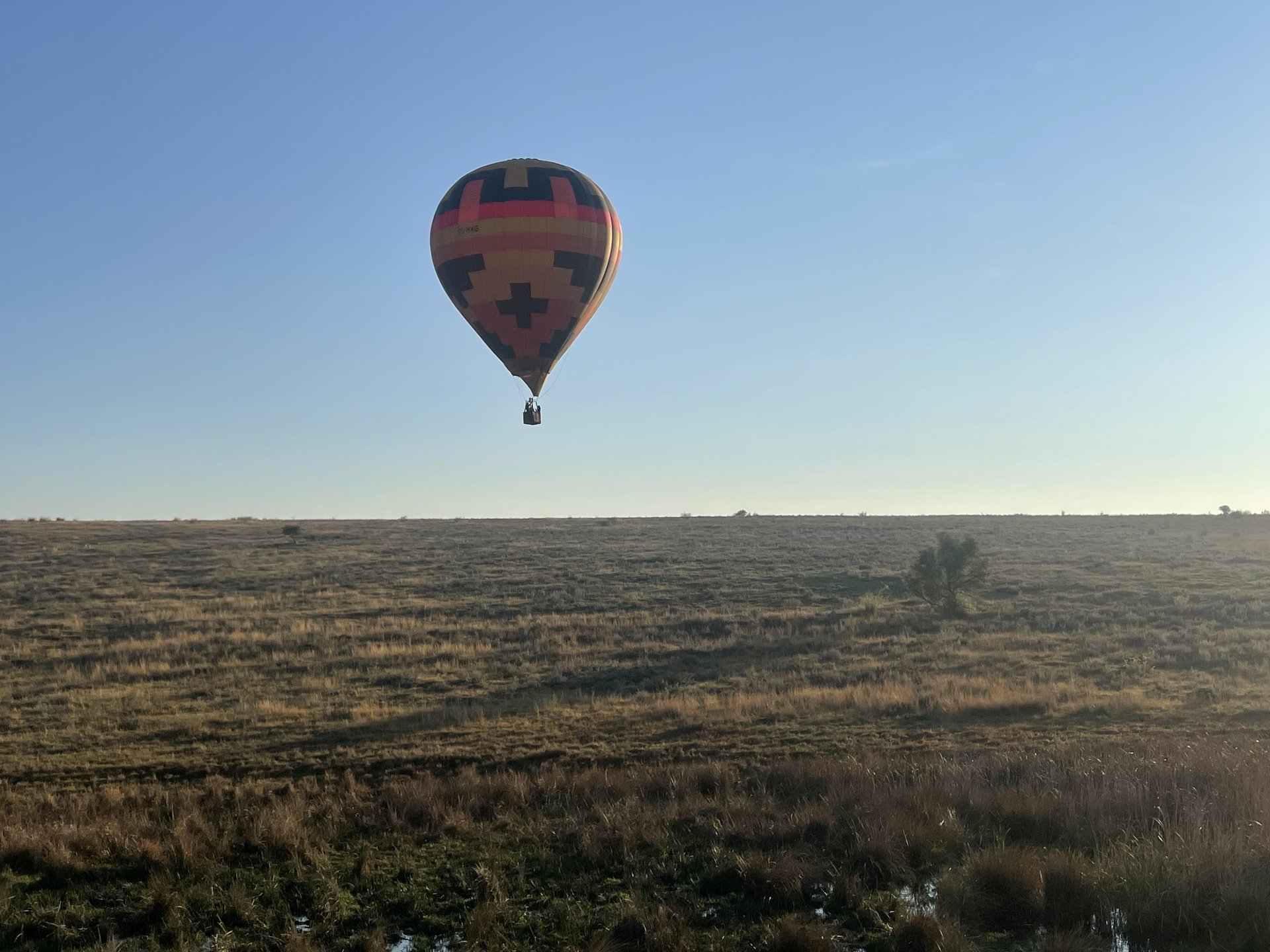 Pilot operating the burner mid-flight