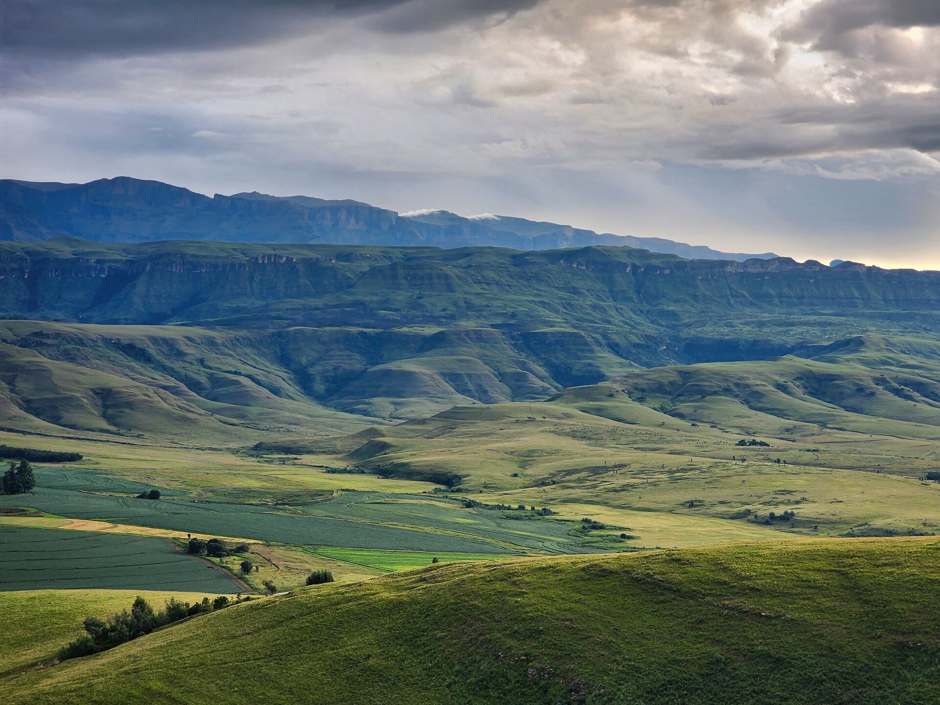 The rolling green hills and dramatic escarpment landscape of KwaZulu-Natal — the terrain that defines Hluhluwe-iMfolozi Park