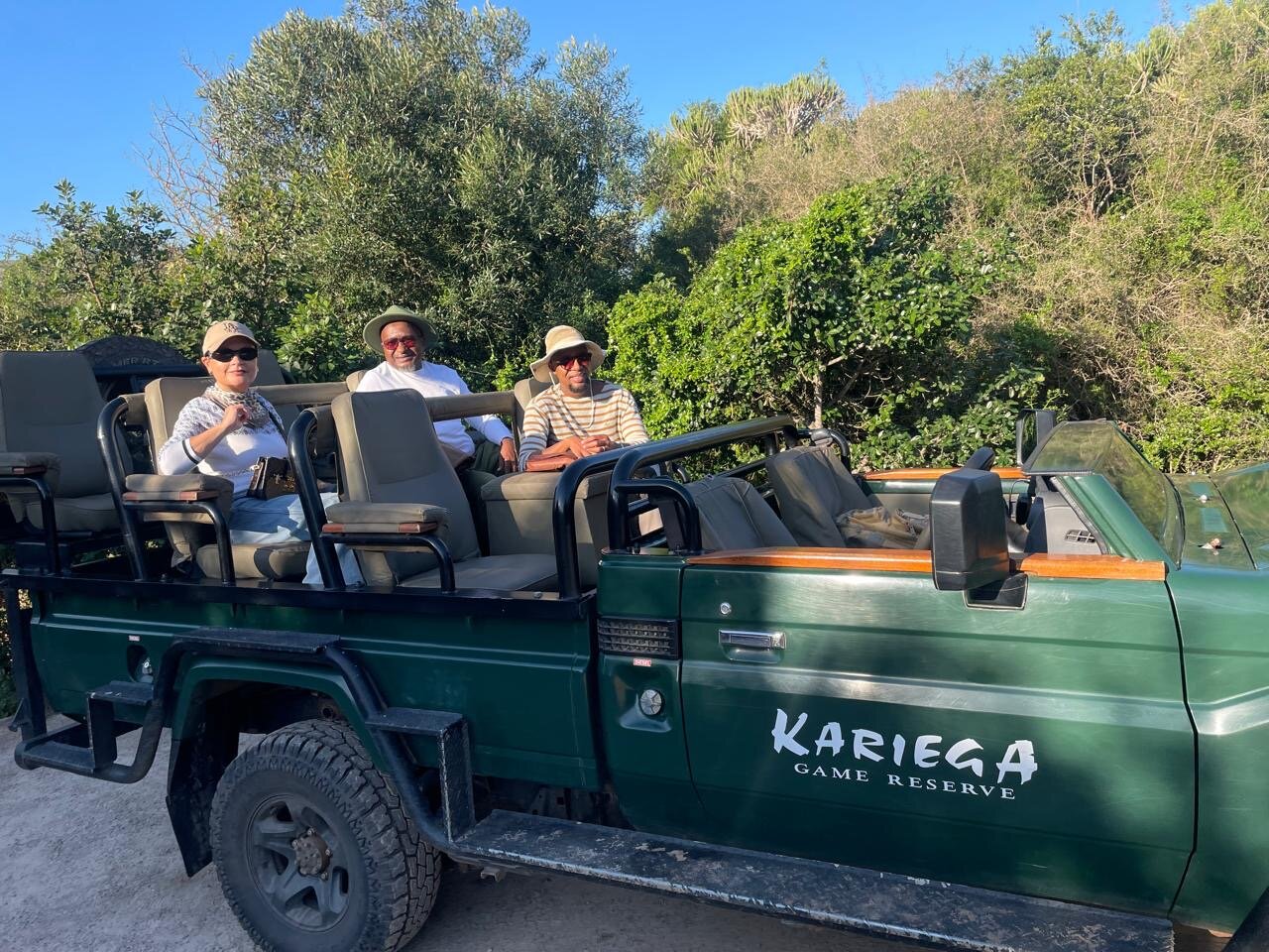 The founders and a friend ready for a game drive aboard the iconic green Kariega Game Reserve vehicle