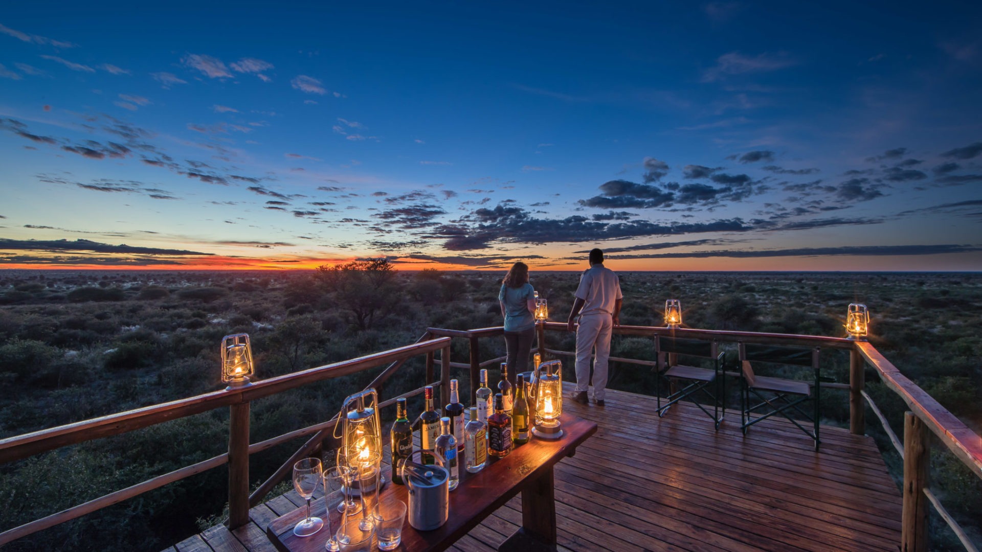 A private sundowner experience overlooking the African wilderness at golden hour