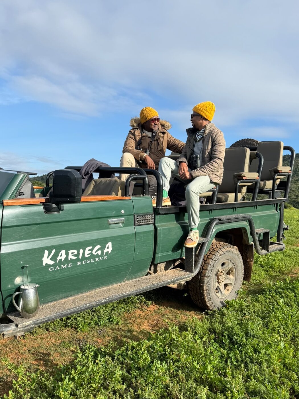 Portrait of Thabo and Katlego looking at each other on the Kariega game-drive vehicle
